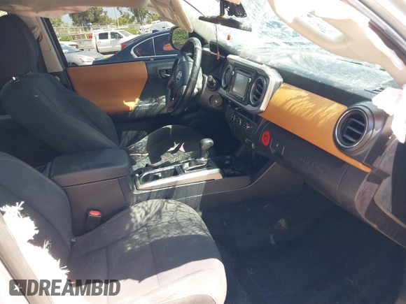 2018 Toyota Tacoma SR with VIN 5TFAX5GN2JX103685, listed as a IAAI auction lot 42392032 with 138,678 mi miles and . Bid and sale history available at DreamBid. Image 5.