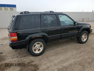 1997 Jeep Grand Cherokee Limited z VIN 1J4GZ78Y8VC586034, wystawiony jako Copart lot #58061705 z przebiegiem 244 355 mil mil oraz Czysty tytuł • Clean title. Historia ofert i sprzedaży dostępna na DreamBid. Obrazek 3.