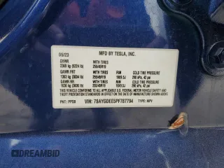 2023 Tesla Model Y Long Range z VIN 7SAYGDEE5PF787794, wystawiony jako Copart lot #55212605 z przebiegiem 30 277 mil mil oraz Szkoda całkowita • Salvage title. Historia ofert i sprzedaży dostępna na DreamBid. Obrazek 13.