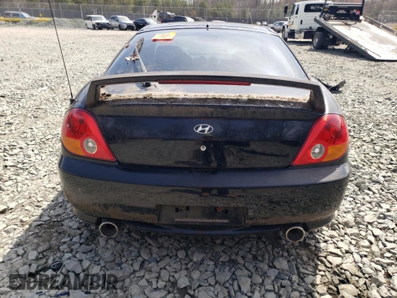 2003 Hyundai Tiburon GT z VIN KMHHN65F13U084620, wystawiony jako Copart lot #46880185 z przebiegiem Nie podano mil oraz Nie do naprawy • Non repairable. Historia ofert i sprzedaży dostępna na DreamBid. Obrazek 6.