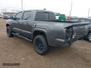 2023 Toyota Tacoma 4WD SR with VIN 3TYCZ5AN5PT157657, listed as a IAAI auction lot 41412536 with 12,828 mi miles. Bid and sale history available at carsss.com. Image 3.