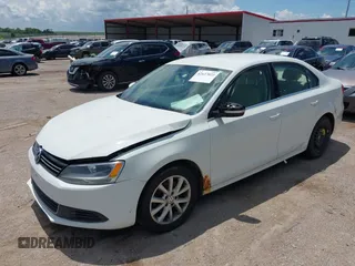 2014 Volkswagen Jetta SE with VIN 3VWD07AJXEM333132, listed as a IAAI auction lot 42637022 with 157,113 mi miles and . Bid and sale history available at DreamBid. Image 2.