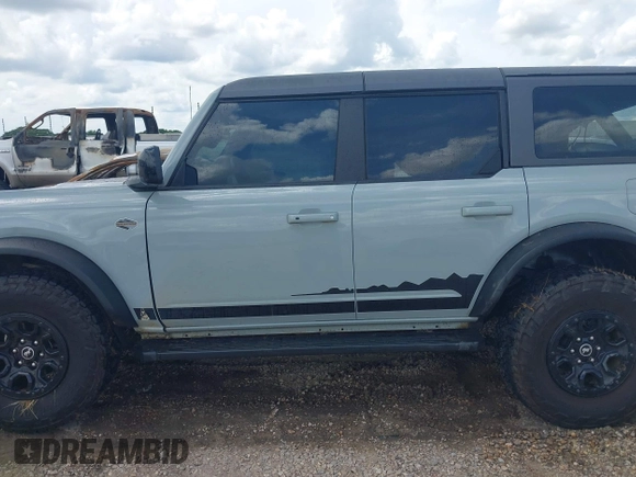 2021 Ford Bronco with VIN 1FMEE5DP6MLA61655, listed as a IAAI auction lot 42492762 with 88,313 mi miles and . Bid and sale history available at DreamBid. Image 14.