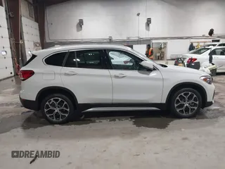 2021 BMW X1 xDrive28i with VIN WBXJG9C04M5T82884, listed as a IAAI auction lot 42242890 with 24,647 mi miles and . Bid and sale history available at DreamBid. Image 13.