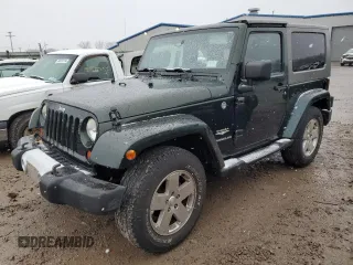 2010 Jeep Wrangler Sahara z VIN 1J4GA5D14AL195879, wystawiony jako Copart lot #85555614 z przebiegiem 86 782 mil mil oraz Szkoda całkowita • Salvage title. Historia ofert i sprzedaży dostępna na DreamBid. Obrazek 1.