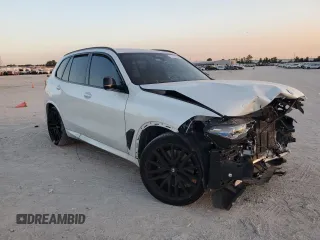 2024 BMW X5 M60i with VIN 5UX33EU07R9T12139, listed as a Copart auction lot 77326454 with 0 mi miles and Salvage Title. Bid and sale history available at carsss.com. Image 4.