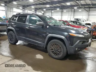 2014 Jeep Cherokee Trailhawk with VIN 1C4PJMBS5EW294212, listed as a Copart auction lot 88816885 with 151,779 mi miles and Salvage title. Bid and sale history available at DreamBid. Image 4.