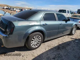 2005 Chrysler 300 with VIN 2C3AA63H35H659798, listed as a Copart auction lot 50322065 with 153,944 mi miles and Salvage Title. Bid and sale history available at carsss.com. Image 3.