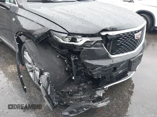 2022 Cadillac XT6 Premium Luxury z VIN 1GYKPDRS8NZ161368, wystawiony jako IAAI lot #41115620 z przebiegiem 140 819 mil mil oraz . Historia ofert i sprzedaży dostępna na DreamBid. Obrazek 6.