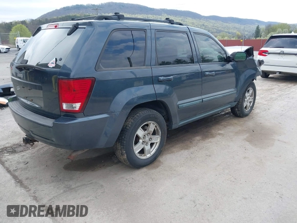 2007 Jeep Grand Cherokee Laredo with VIN 1J8GR48K07C692148, listed as a IAAI auction lot 42079608 with 245,605 mi miles. Bid and sale history available at carsss.com. Image 4.