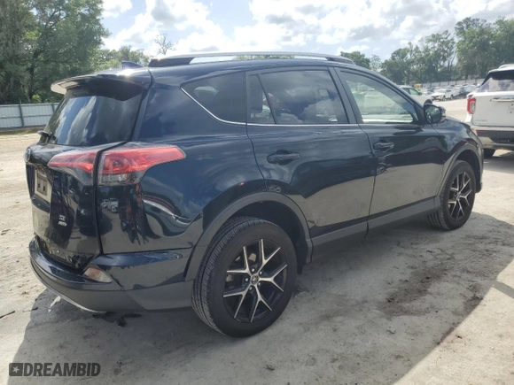 2018 Toyota RAV4 SE with VIN JTMJFREVXJD256779, listed as a Copart auction lot 52521195 with 100,453 mi miles and Salvage Title. Bid and sale history available at carsss.com. Image 3.