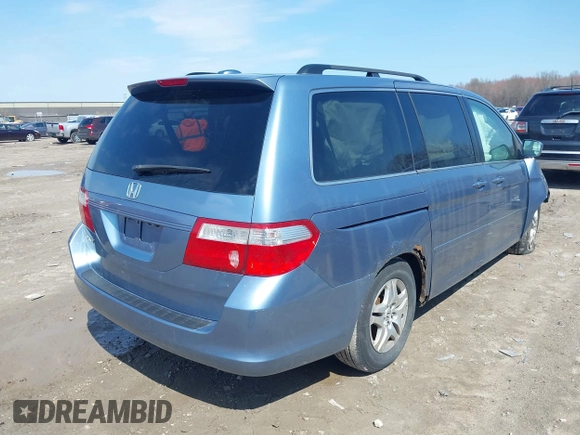 2007 Honda Odyssey EX-L with VIN 5FNRL38727B092077, listed as a IAAI auction lot 41972810 with 211,770 mi miles and . Bid and sale history available at DreamBid. Image 4.