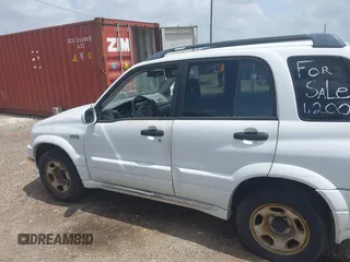 2002 Suzuki Grand Vitara JS z VIN JS3TE62VX24154819, wystawiony jako IAAI lot #42409780 z przebiegiem 160 545 mil mil oraz . Historia ofert i sprzedaży dostępna na DreamBid. Obrazek 6.