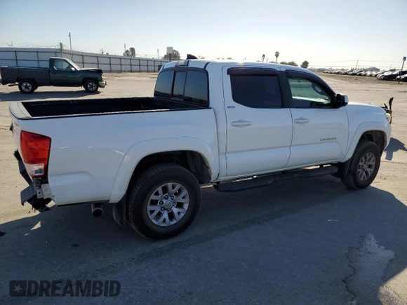 2017 Toyota Tacoma SR z VIN 5TFAX5GNXHX074690, wystawiony jako Copart lot #56672165 z przebiegiem 107 292 mil mil oraz Szkoda całkowita • Salvage title. Historia ofert i sprzedaży dostępna na DreamBid. Obrazek 3.