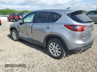 2014 Mazda CX-5 Touring z VIN JM3KE2CY0E0412733, wystawiony jako Copart lot #55803865 z przebiegiem 161 539 mil mil oraz Szkoda całkowita • Salvage title. Historia ofert i sprzedaży dostępna na DreamBid. Obrazek 2.