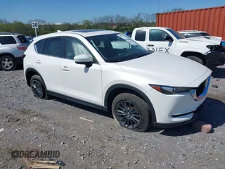 2021 Mazda CX-5 Touring z VIN JM3KFBCM2M1395663, wystawiony jako IAAI lot #41948073 z przebiegiem 47 029 mil mil oraz . Historia ofert i sprzedaży dostępna na DreamBid. Obrazek 1.
