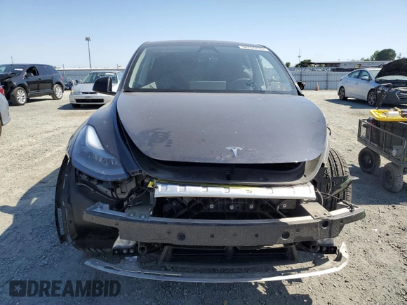 2024 Tesla Model Y Long Range z VIN 7SAYGAEE0RF101971, wystawiony jako Copart lot #58794335 z przebiegiem 16 099 mil mil oraz Szkoda całkowita • Salvage title. Historia ofert i sprzedaży dostępna na DreamBid. Obrazek 5.