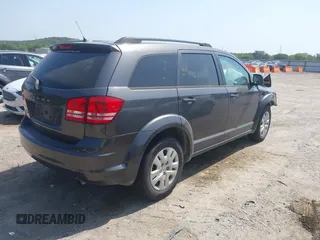 2016 Dodge Journey SE with VIN 3C4PDCAB6GT107930, listed as a IAAI auction lot 39819193 with 113,725 mi miles. Bid and sale history available at carsss.com. Image 4.