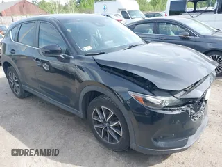 2018 Mazda CX-5 Touring z VIN JM3KFBCM9J0358997, wystawiony jako IAAI lot #42332606 z przebiegiem 93 952 mil mil oraz . Historia ofert i sprzedaży dostępna na DreamBid. Obrazek 1.