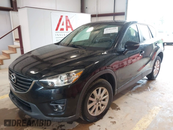 2016 Mazda CX-5 Touring with VIN JM3KE2CY7G0867355, listed as a IAAI auction lot 41963169 with 117,727 mi miles and . Bid and sale history available at DreamBid. Image 2.