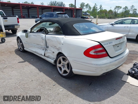 2005 Mercedes-Benz CLK 5.0L with VIN WDBTK75J55F123328, listed as a IAAI auction lot 42082590 with 58,969 mi miles. Bid and sale history available at carsss.com. Image 3.