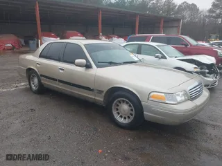 1999 Ford Crown Victoria LX with VIN 2FAFP74W9XX158013, listed as a IAAI auction lot 41556810 with 201,073 mi miles. Bid and sale history available at carsss.com. Image 1.