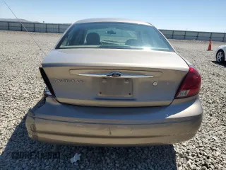 2003 Ford Taurus LX Standard z VIN 1FAFP52U63G277370, wystawiony jako Copart lot #56184345 z przebiegiem 115 778 mil mil oraz Szkoda całkowita • Salvage title. Historia ofert i sprzedaży dostępna na DreamBid. Obrazek 6.