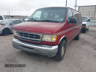 1999 Ford Econoline Cargo with VIN 1FDRE14W0XHB06565, listed as a IAAI auction lot 41496511 with 165,268 mi miles. Bid and sale history available at carsss.com. Image 2.