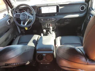 2024 Jeep Wrangler Sahara with VIN 1C4RJXP63RW195206, listed as a Copart auction lot 48784595 with 10,737 mi miles and Salvage Title. Bid and sale history available at DreamBid. Image 8.