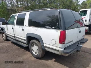 1999 GMC Suburban with VIN 1GKFK16R4XJ798754, listed as a IAAI auction lot 41998578 with 266,899 mi miles. Bid and sale history available at carsss.com. Image 3.