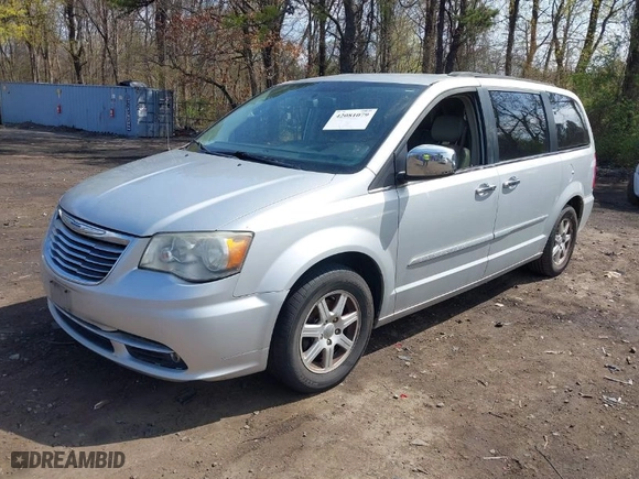 2012 Chrysler Town & Country Touring-L with VIN 2C4RC1CG1CR244943, listed as a IAAI auction lot 42081079 with 164,412 mi miles. Bid and sale history available at carsss.com. Image 2.