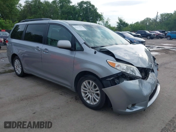 2014 Toyota Sienna XLE z VIN 5TDYK3DC6ES488569, wystawiony jako IAAI lot #42171540 z przebiegiem 97 416 mil mil oraz . Historia ofert i sprzedaży dostępna na DreamBid. Obrazek 1.