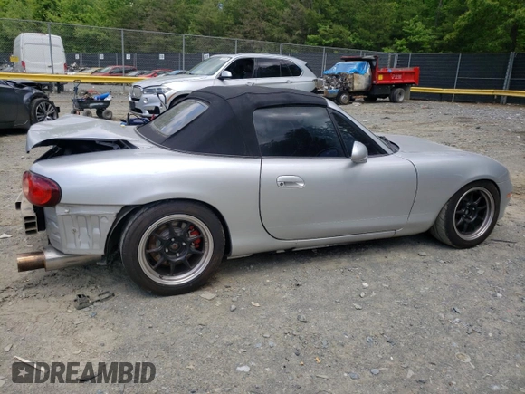 2004 Mazda MX-5 Miata LS with VIN JM1NB353640400140, listed as a Copart auction lot 56127165 with 123,276 mi miles and Salvage title. Bid and sale history available at DreamBid. Image 3.