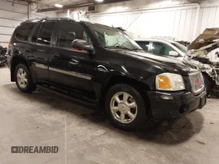 2004 GMC Envoy SLE with VIN 1GKDT13S542265104, listed as a IAAI auction lot 41884797 with 154,190 mi miles. Bid and sale history available at carsss.com. Image 1.