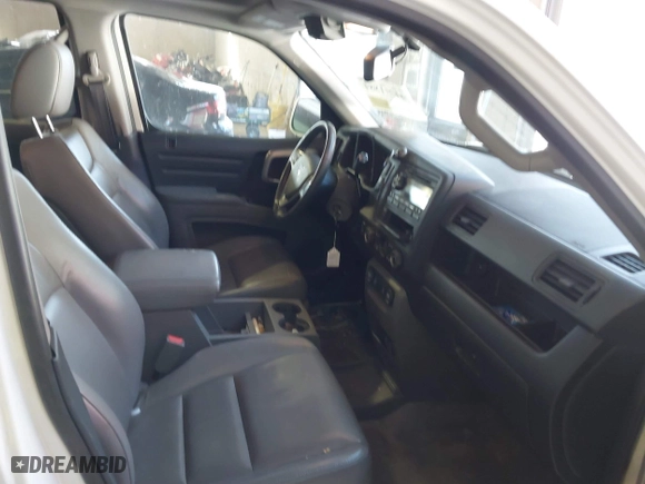 2014 Honda Ridgeline RTL with VIN 5FPYK1F55EB012490, listed as a IAAI auction lot 41391884 with 130,121 mi miles. Bid and sale history available at carsss.com. Image 5.