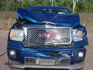 2015 GMC Sierra 1500 Denali z VIN 3GTP1WEC2FG201307, wystawiony jako IAAI lot #41931366 z przebiegiem 99 644 mil mil oraz . Historia ofert i sprzedaży dostępna na DreamBid. Obrazek 11.