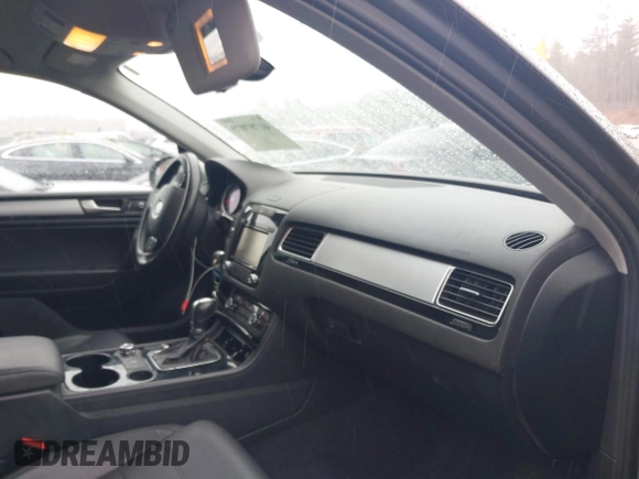 2013 Volkswagen Touareg Lux with VIN WVGEF9BP7DD007170, listed as a IAAI auction lot 41787075 with 131,089 mi miles and . Bid and sale history available at DreamBid. Image 5.