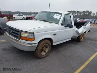 1996 Ford F-150 Special with VIN 1FTEF15Y0TLC18418, listed as a IAAI auction lot 41468561 with 167,001 mi miles. Bid and sale history available at carsss.com. Image 2.