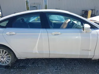 2013 Ford Fusion SE Hybrid z VIN 3FA6P0LU9DR349321, wystawiony jako IAAI lot #42156321 z przebiegiem 90 688 mil mil oraz . Historia ofert i sprzedaży dostępna na DreamBid. Obrazek 13.