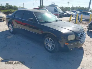 2009 Chrysler 300 Touring with VIN 2C3LA53V99H575533, listed as a IAAI auction lot 41775885 with 151,984 mi miles. Bid and sale history available at carsss.com. Image 1.