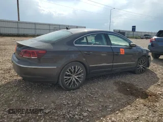 2014 Volkswagen CC VR6 Executive 4Motion with VIN WVWGU7AN9EE523145, listed as a Copart auction lot 71419134 with 94,547 mi miles and Salvage Title. Bid and sale history available at carsss.com. Image 3.