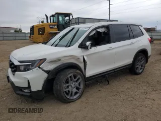 2023 Honda Passport EX-L with VIN 5FNYF8H58PB044081, listed as a Copart auction lot 71631594 with 5,981 mi miles and Salvage Title. Bid and sale history available at carsss.com. Image 1.