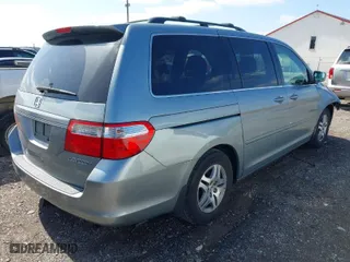 2005 Honda Odyssey EX-L with VIN 5FNRL38765B094377, listed as a IAAI auction lot 41933616 with 213,979 mi miles. Bid and sale history available at carsss.com. Image 4.