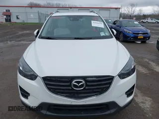 2016 Mazda CX-5 Grand Touring z VIN JM3KE4DY0G0705884, wystawiony jako IAAI lot #42016910 z przebiegiem 73 324 mil mil oraz . Historia ofert i sprzedaży dostępna na DreamBid. Obrazek 12.