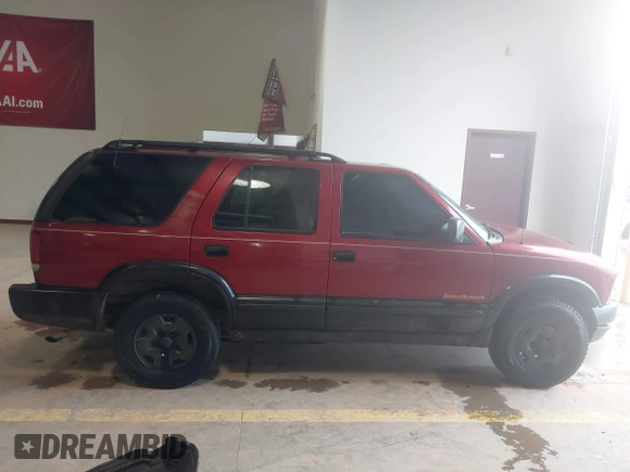 1999 Chevrolet Blazer Trailblazer z VIN 1GNDT13W4X2187490, wystawiony jako IAAI lot #41966073 z przebiegiem 187 604 mil mil oraz . Historia ofert i sprzedaży dostępna na DreamBid. Obrazek 14.