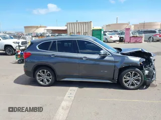 2017 BMW X1 xDrive28i with VIN WBXHT3Z31H4A56113, listed as a IAAI auction lot 42397932 with 70,252 mi miles and . Bid and sale history available at DreamBid. Image 14.