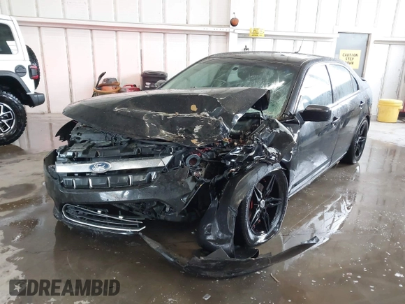 2012 Ford Fusion SE z VIN 3FAHP0HA5CR403929, wystawiony jako IAAI lot #42353429 z przebiegiem 208 668 mil mil oraz . Historia ofert i sprzedaży dostępna na DreamBid. Obrazek 6.
