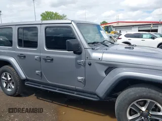 2019 Jeep Wrangler Unlimited Sahara with VIN 1C4HJXEN5KW542403, listed as a IAAI auction lot 42159197 with 60,378 mi miles and . Bid and sale history available at DreamBid. Image 13.