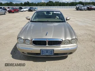 2004 Jaguar XJ with VIN SAJWA71C24SG28164, listed as a Copart auction lot 73968134 with 0 mi miles and Salvage Title. Bid and sale history available at carsss.com. Image 5.