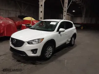 2016 Mazda CX-5 Touring with VIN JM3KE4CY0G0853261, listed as a IAAI auction lot 41861176 with 63,491 mi miles. Bid and sale history available at carsss.com. Image 2.